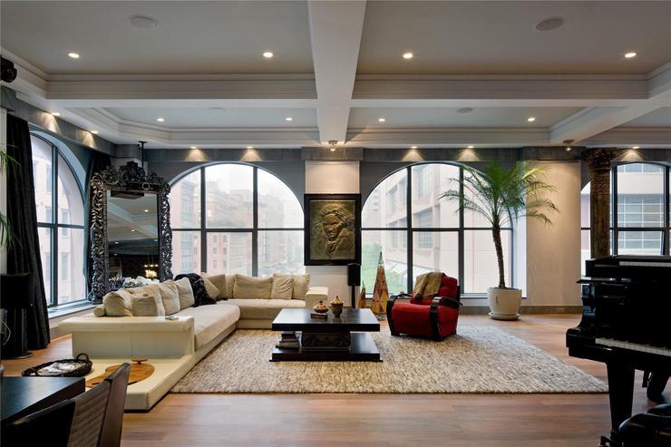 Header white living room and white fur rug as wooden floor and single red sofa white roof top 408 greenwich 04 011