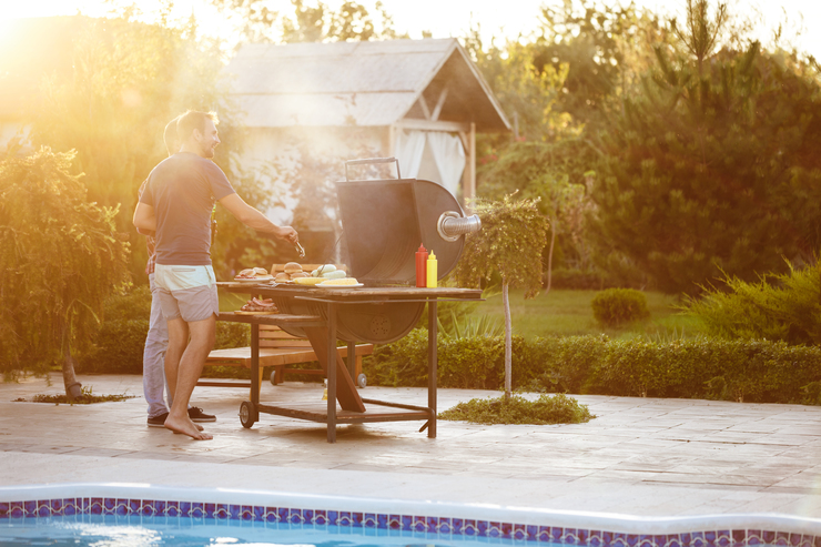 Header young men roasting barbecue grill cottage countryside