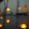 Art thumb look through the lamps at shiny moscow city