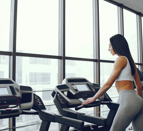 Vertical slider beautiful elegant girl standing gym