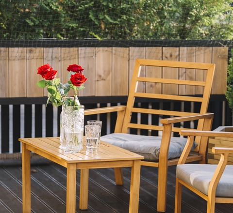 Vertical slider beautiful red rose vase drink wooden table rooftop