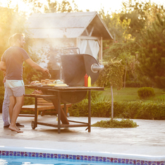 Thumb young men roasting barbecue grill cottage countryside